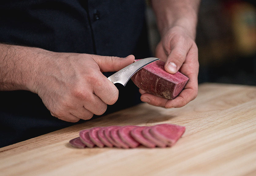 Slicing Vegetables With A Bird's Beak Paring Knife