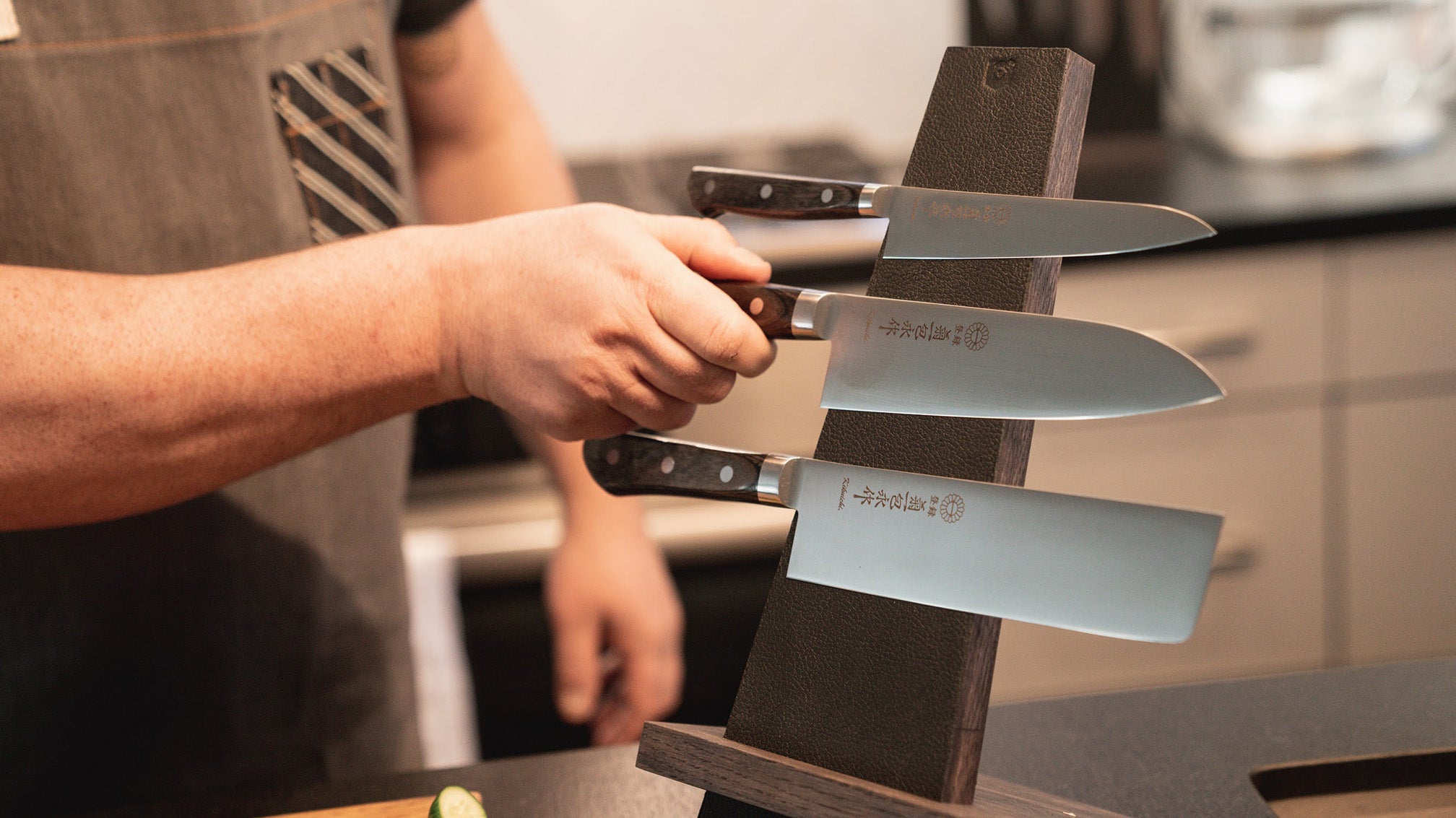 Three knives on a magnetic block at home